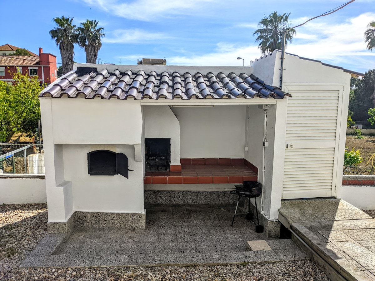 Outdoor BBQ area with forno oven.