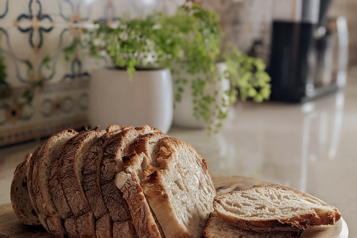 A bread van drives past every morning usually between 9-10:30am. Listen for his song to get your fresh bread! Payment is by cash only.