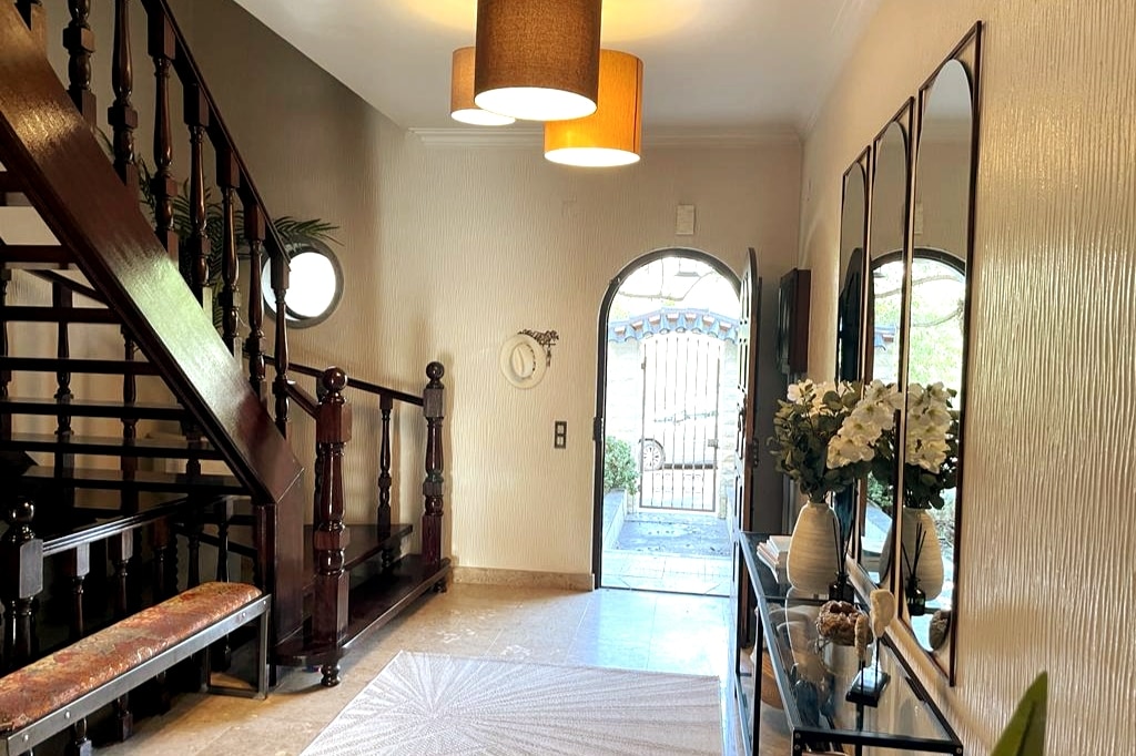 Entry Foyer and open slat staircase