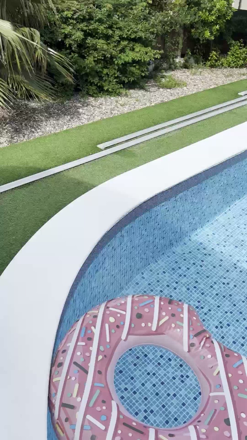 The lawn and pool, with space to run a morning session outside